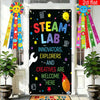 A black door decorated with colorful stars and a banner welcoming innovators, explorers, and creatives to the STEAM lab.