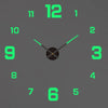 A digital clock face with green numbers and hands on a gray background.