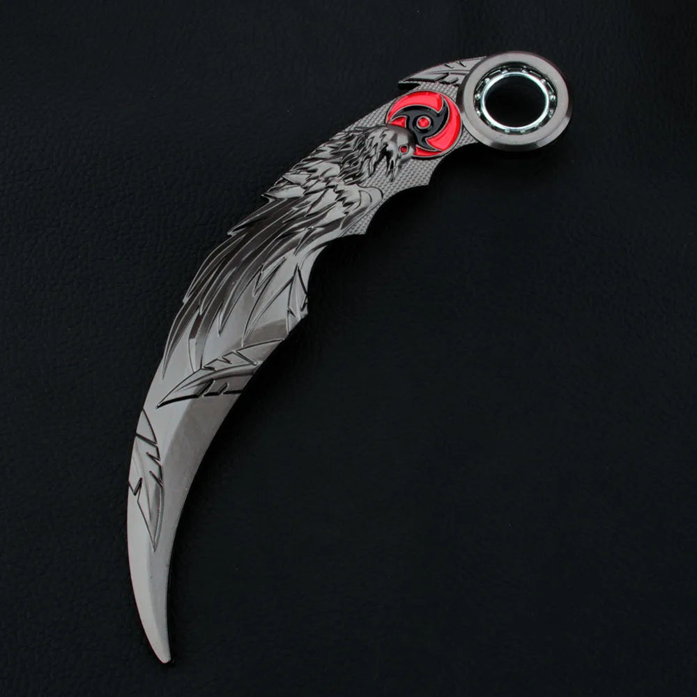A silver collectible knife model featuring an anime-style blue dragon rotating claw blade and a red accent.