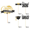 A set of black and gold glitter graduation cake toppers featuring text like Congrats Graduates and Class of 2026.