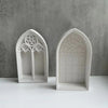 White silicone mold shaped like a Gothic church window for crafting resin or plaster