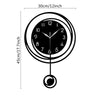 A black modern circular wall clock face showing the time, with a pendulum hanging below.