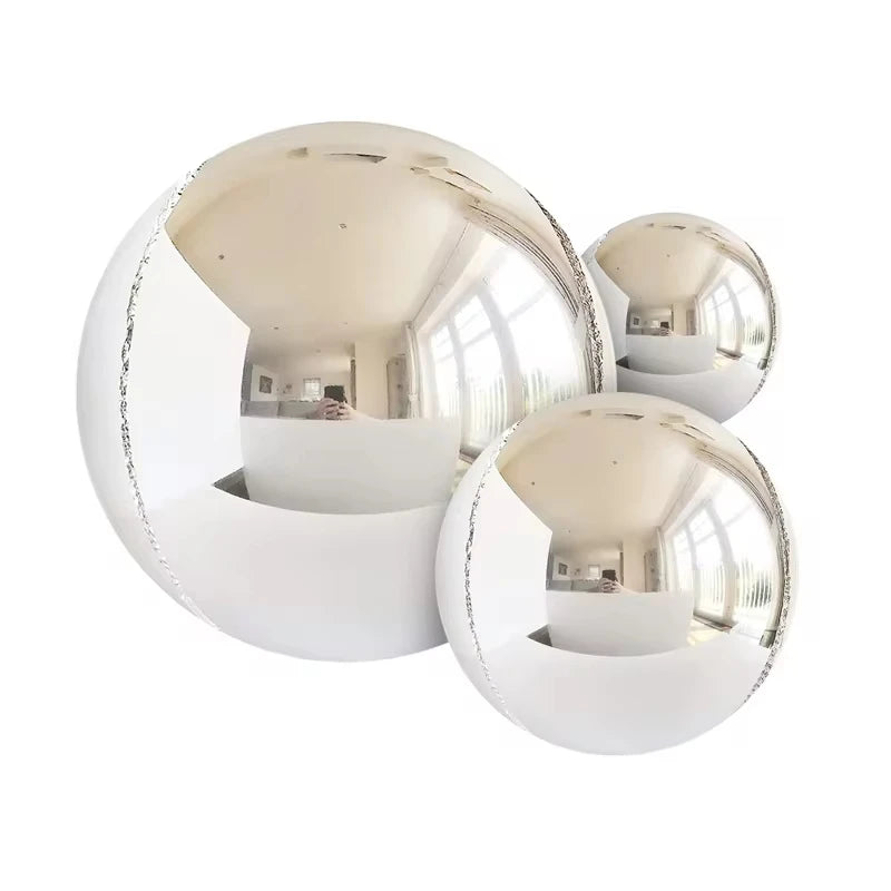 A collection of 14 metallic chrome balloons in various sizes and finishes.