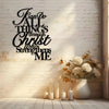 Black script wall art featuring the verse "Fan Do All Things through Christ strengthens me" displayed on a white brick wall.
