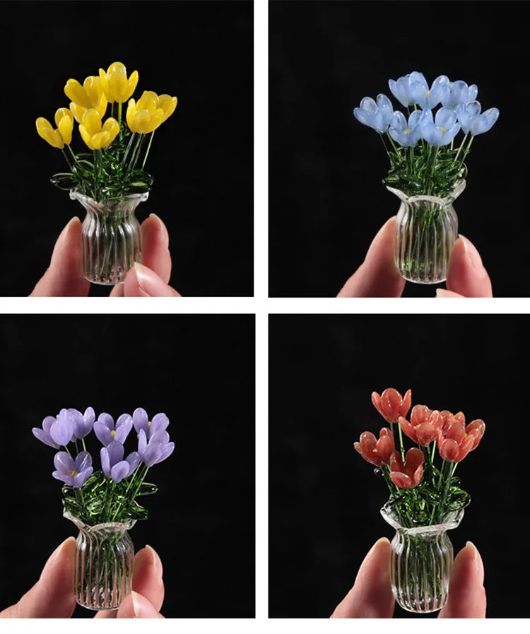 Handmade glass flower bouquets featuring yellow, blue, and purple tulips in clear glass vases.