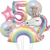 A collection of pink and iridescent foil balloons, including a number 5, a unicorn, and a rainbow arch.