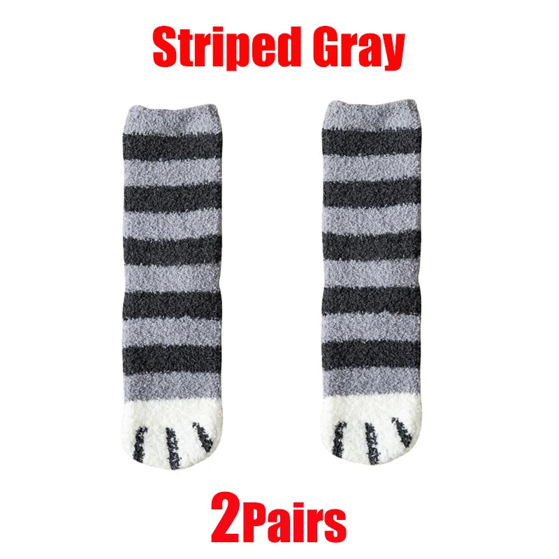 A pair of striped gray cozy cat paw print plush socks.