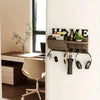 A rustic wooden wall key holder with a shelf and seven hooks mounted on a white wall.