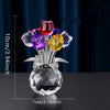 A crystal rose decorative flower arrangement featuring colorful glass roses on a clear base.