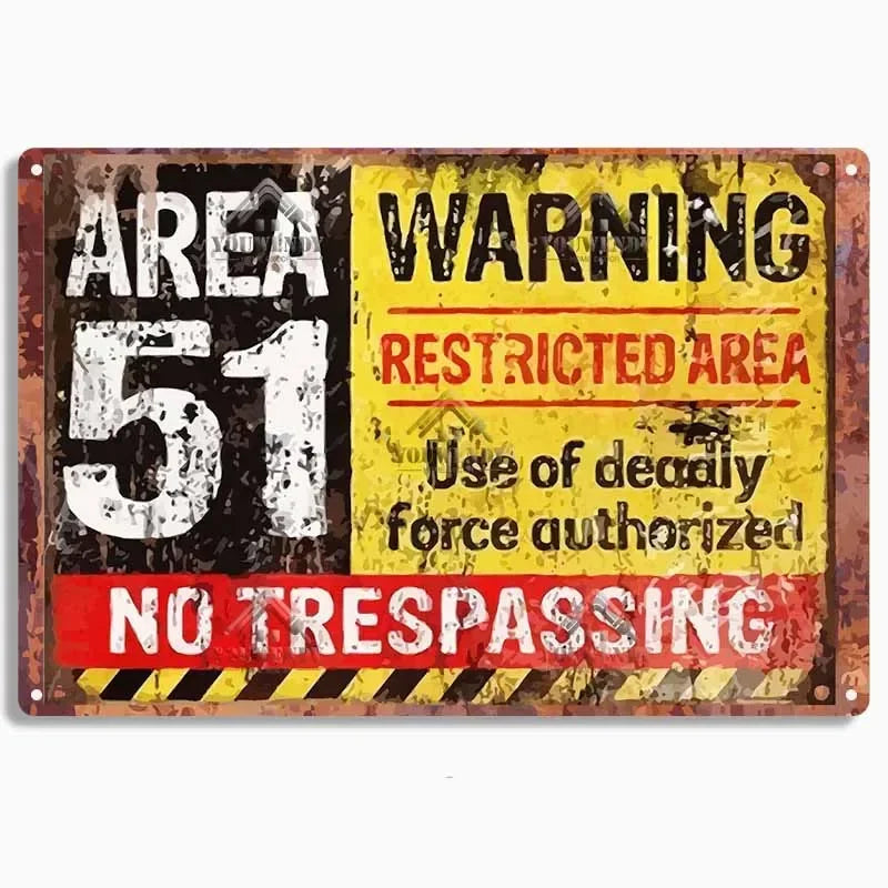 A vintage metal sign with a distressed yellow and black background warning area 51 restricted area no trespassing