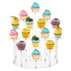 A clear acrylic display rack holding various colorful cupcakes with frosting on a tiered stand.