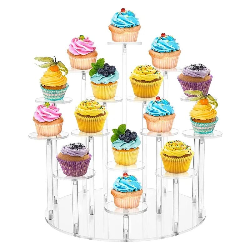 A clear acrylic display rack holding various colorful cupcakes with frosting on a tiered stand.