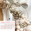 A beige and gold balloon garland featuring round balloons arranged in a cascading design.
