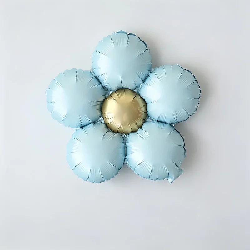 A set of five matte foil balloons in light blue with a gold center, shaped like flowers.