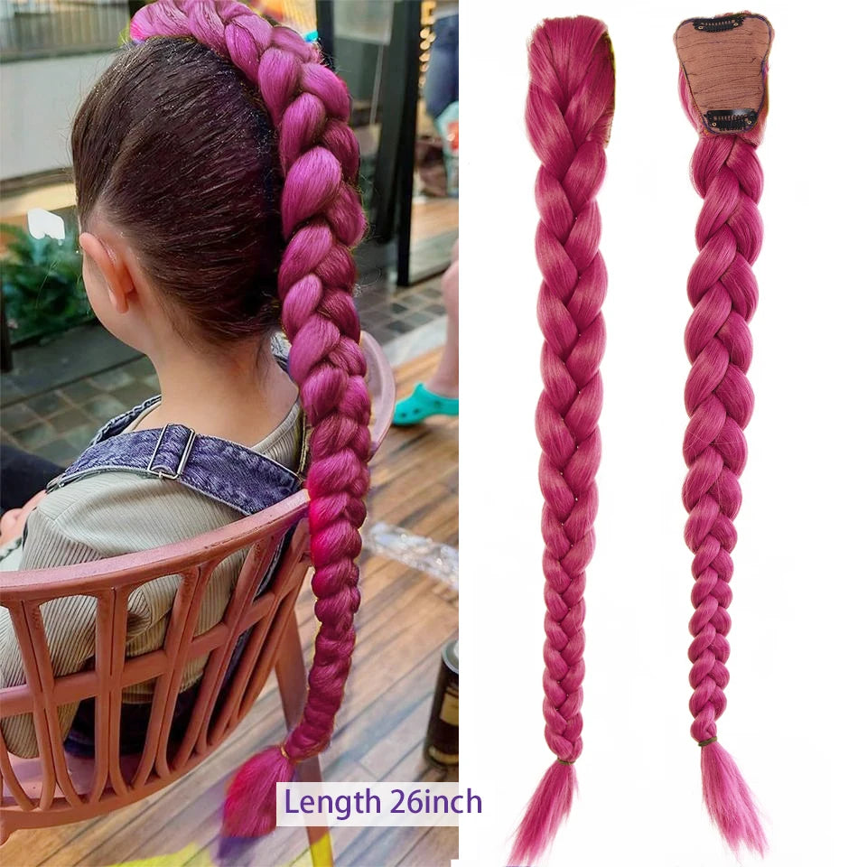 A long pink braided ponytail hairpiece with a leather tie is shown next to a child's head.