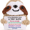 Handmade crochet sloth doll with a positive message card featuring the text You are enough.