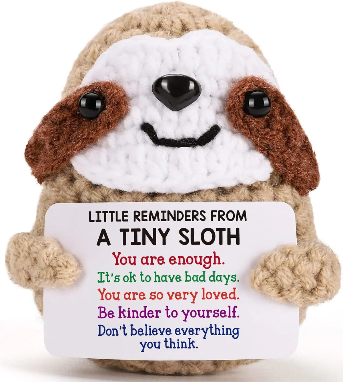 Handmade crochet sloth doll with a positive message card featuring the text You are enough.