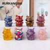 A collection of natural fox crystal sculptures in various colors and textures displayed on a white surface.