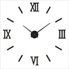A white clock face with Roman numerals showing the time, featuring black hands and modern 3D acrylic numbers.