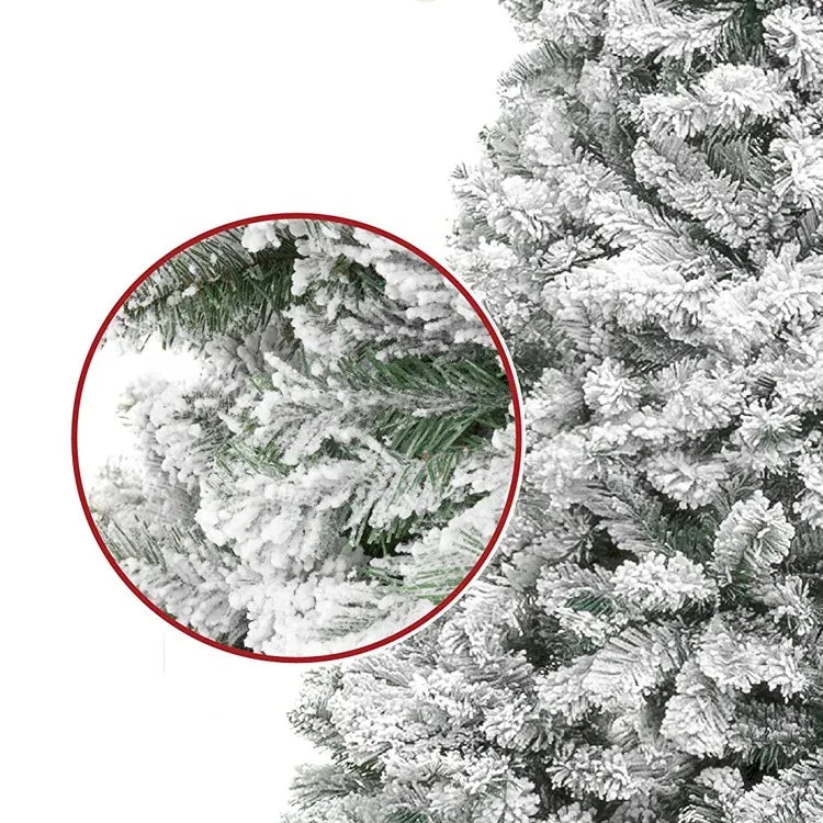 Close-up view of a flocked artificial Christmas tree with realistic snowy branches.