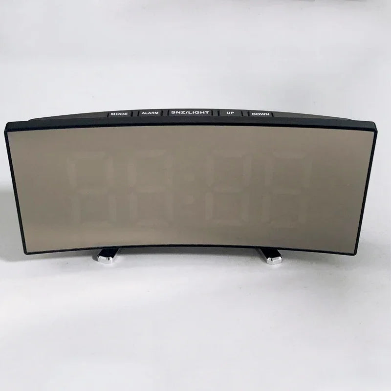 An LED mirror alarm clock with a large curved display showing time and controls for mode, alarm, and light.