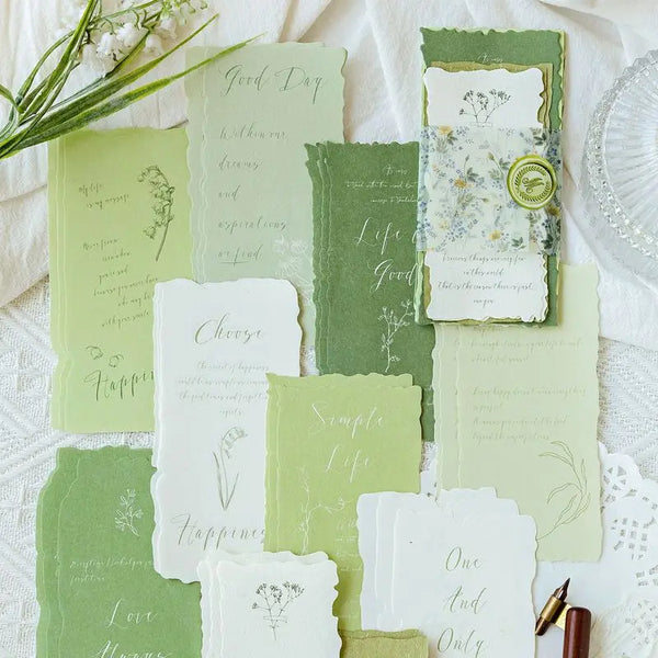 A collection of vintage old English manuscript decor paper in sage green and cream tones.
