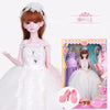 A detailed doll wearing a white princess ball gown with lace and makeup, displayed next to its packaging.