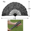 A black lace folding hand fan with a 48g weight, shown in an open fan and held by a hand.