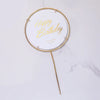 A gold glitter birthday sign with the words Happy Birthday and Best Wishes for you on a thin gold stick.