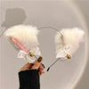 A white fluffy cat ear headband and bell choker set displayed against a light background.