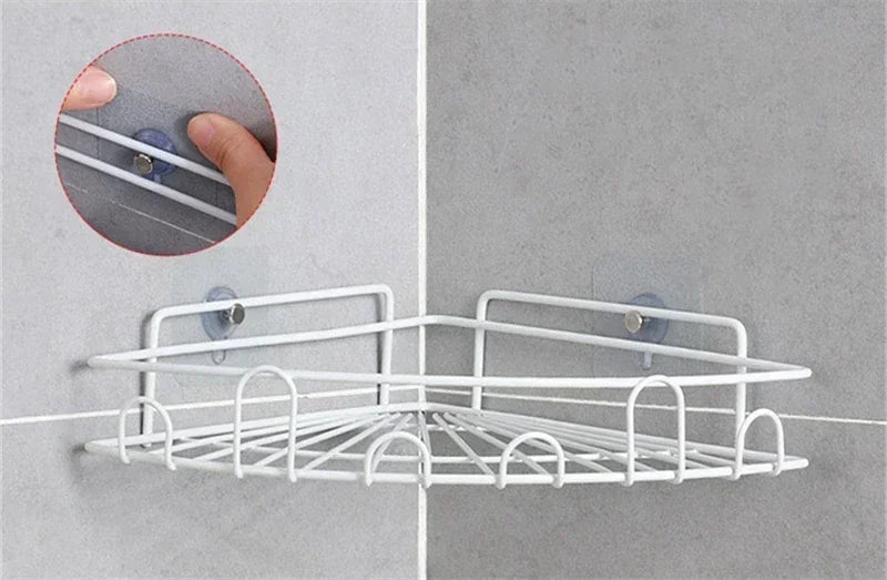 White wire mesh wall hooks installed on a gray wall, demonstrating strong adhesive mounting.