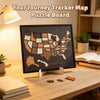 A framed puzzle board featuring a map of the USA made of wooden pieces on a wooden desk.