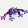 A realistic 3D frog fridge magnet with movable joints in purple and orange colors.