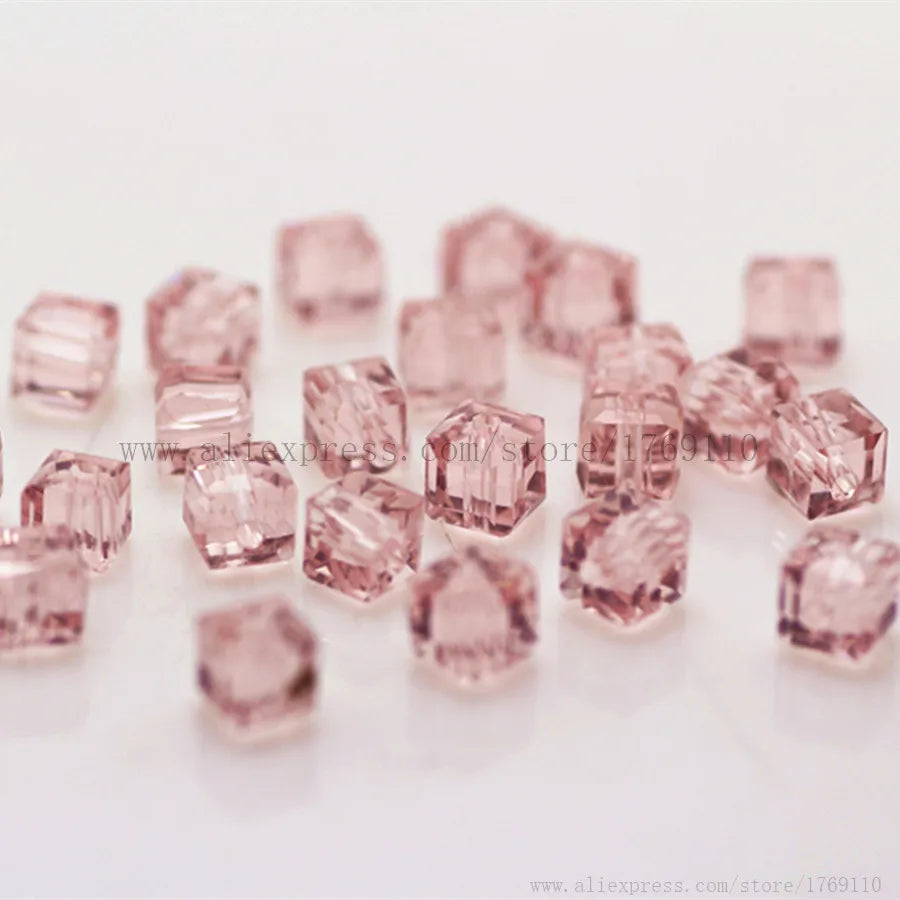 A collection of square cut pink glass crystal beads for jewelry making