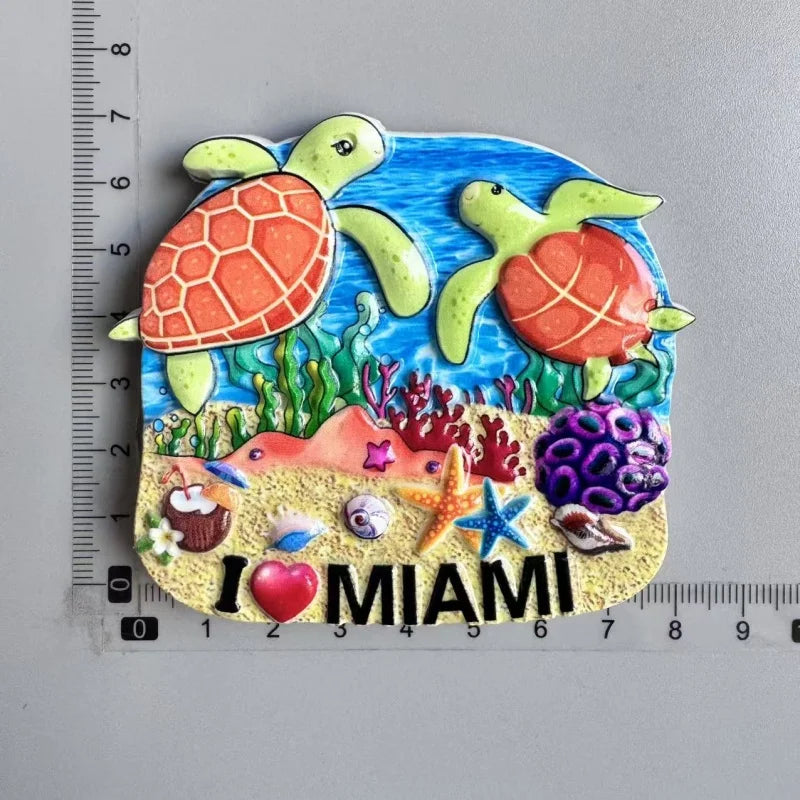 A set of colorful fridge magnets featuring Miami-themed designs including a sea turtle and tropical elements.