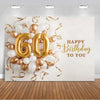 A balloon backdrop featuring gold and white balloons and the number 60, with gold ribbon streamers and birthday text.