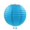 A bright blue round paper lantern.