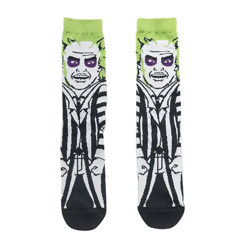 Pair of novelty crew socks featuring a graphic print of a skull, alien, and tiger face.