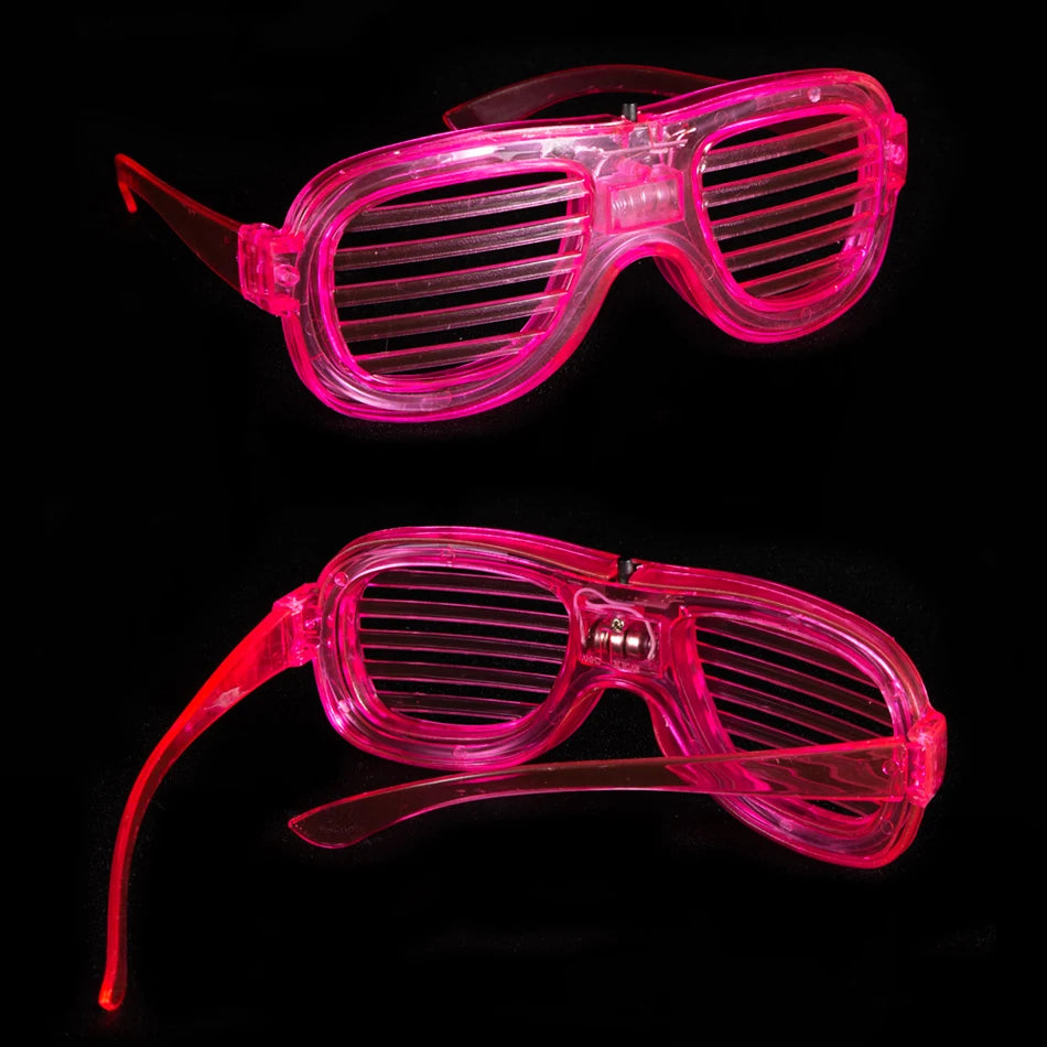 A pair of bright pink, translucent LED light-up glow glasses with a flexible frame and a long arm.
