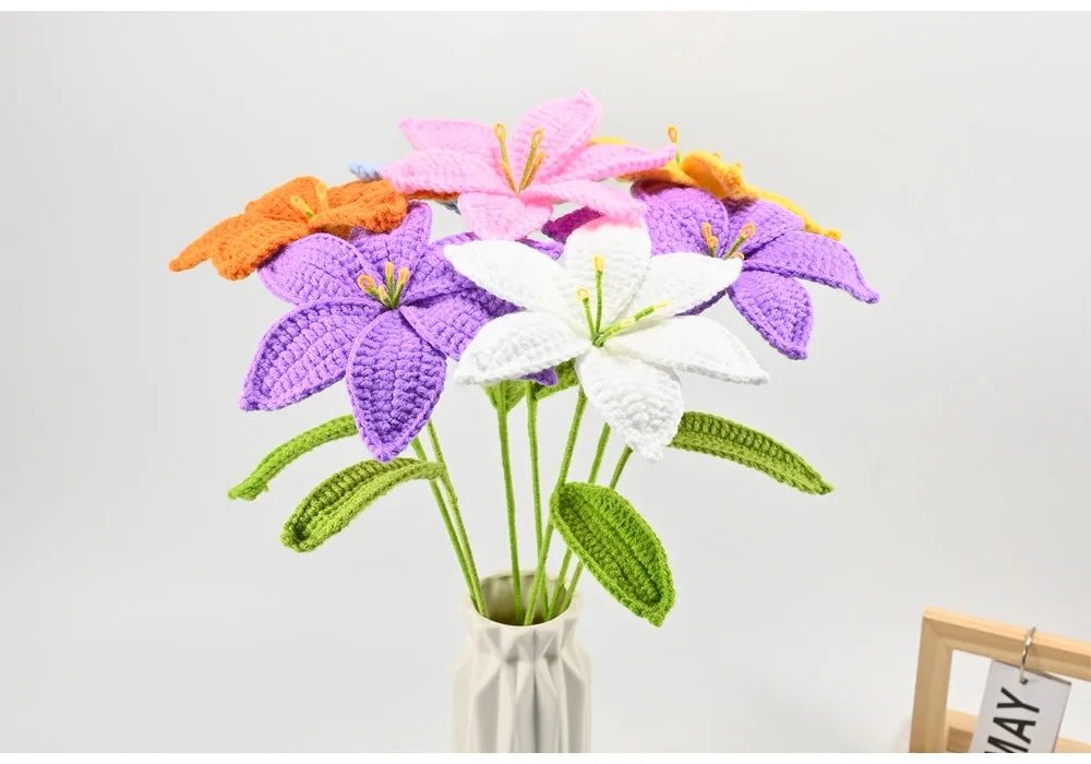 Hand-crocheted artificial lily bouquet featuring purple, white, and orange flowers on green stems