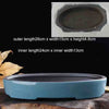 A light blue glazed ceramic bonsai flower pot with a wide rim and a slightly flared base.
