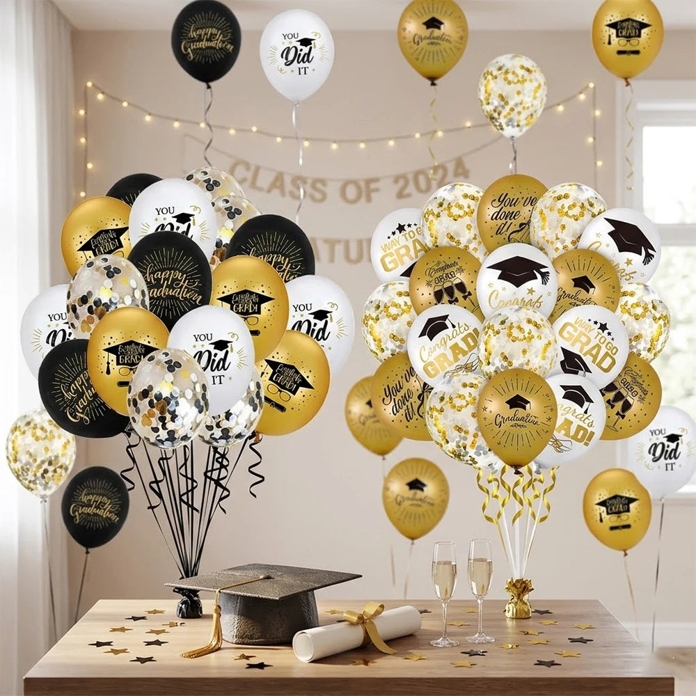 A bouquet of black, gold, and white graduation balloons with cap and star designs arranged on a wooden table.