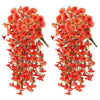 A pair of vibrant orange and red silk morning glory vine wreaths used as hanging garlands for decor.