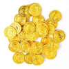 A pile of shiny gold pirate coins, likely used as party favors.