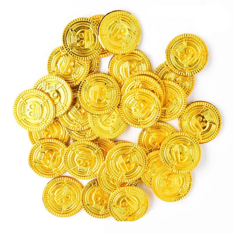 A pile of shiny gold pirate coins, likely used as party favors.