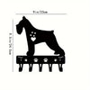 Black decorative metal key hooks for wall organization displayed on a white background.