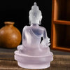 Handcrafted resin Medicine Buddha statue in translucent purple color sitting on a base
