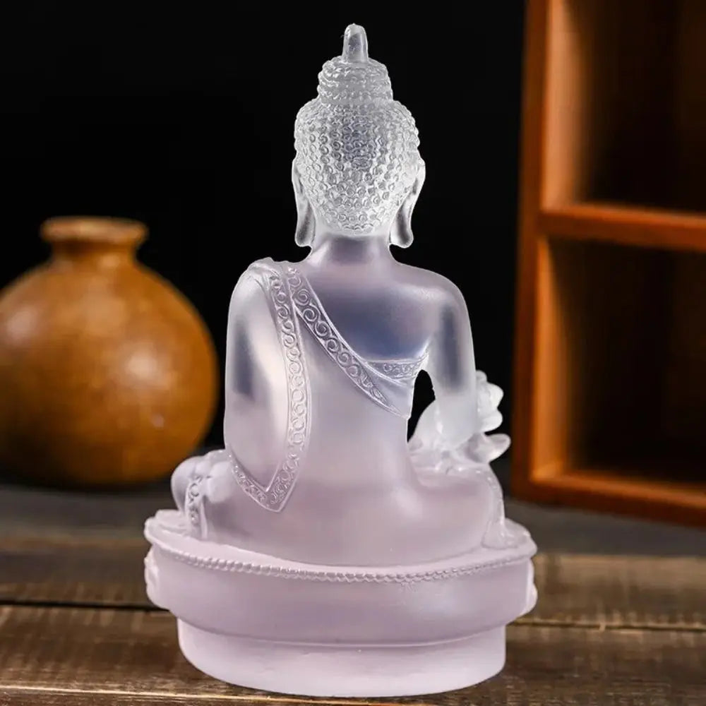 Handcrafted resin Medicine Buddha statue in translucent purple color sitting on a base
