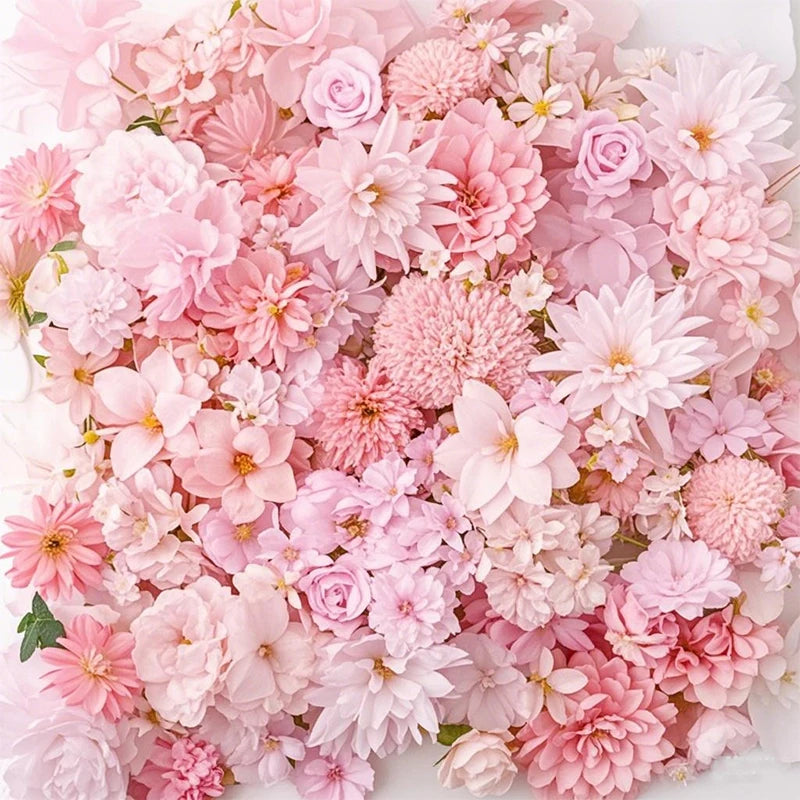 A dense arrangement of pink and blush silk artificial flower heads for crafts and decor.