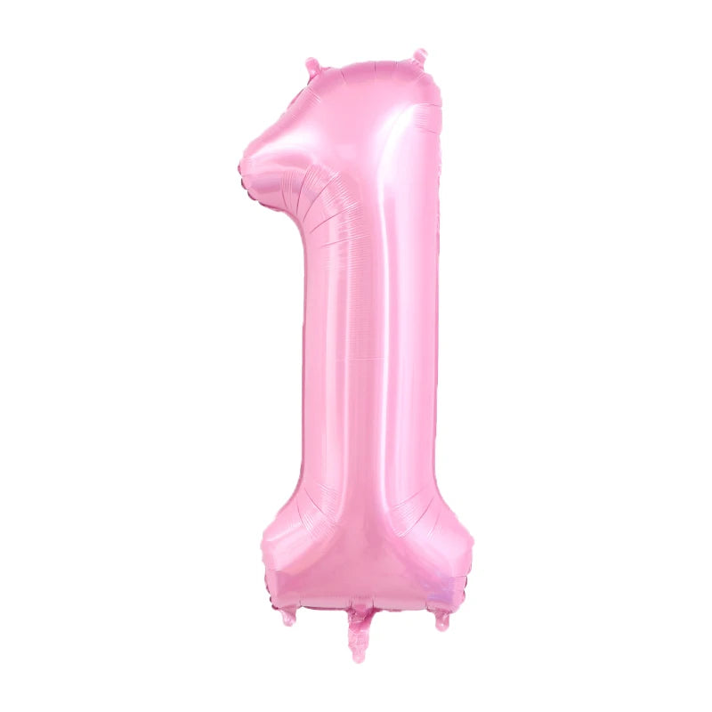 A large, pink foil number balloon shaped like the number one.